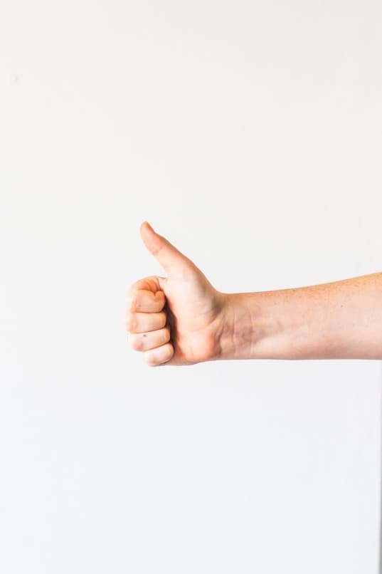 Hand showing thumbs up